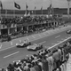 A black and white photo of the two Mercedes cars leading the 1954 French Grand prix.